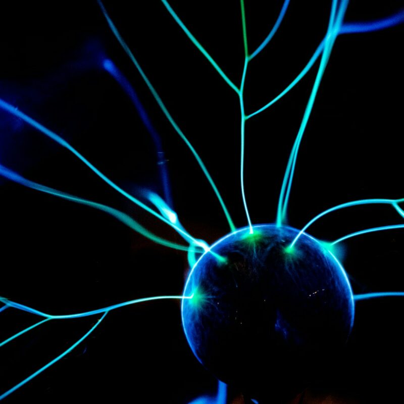 a close up of a blue light in the dark